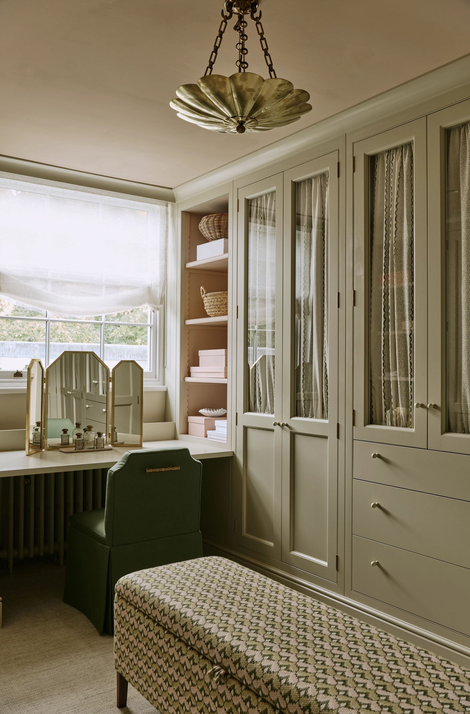 dressing-room-with-pae-green-cabinets-and-patterned-ottoman-in-south-kensington-family-home-project