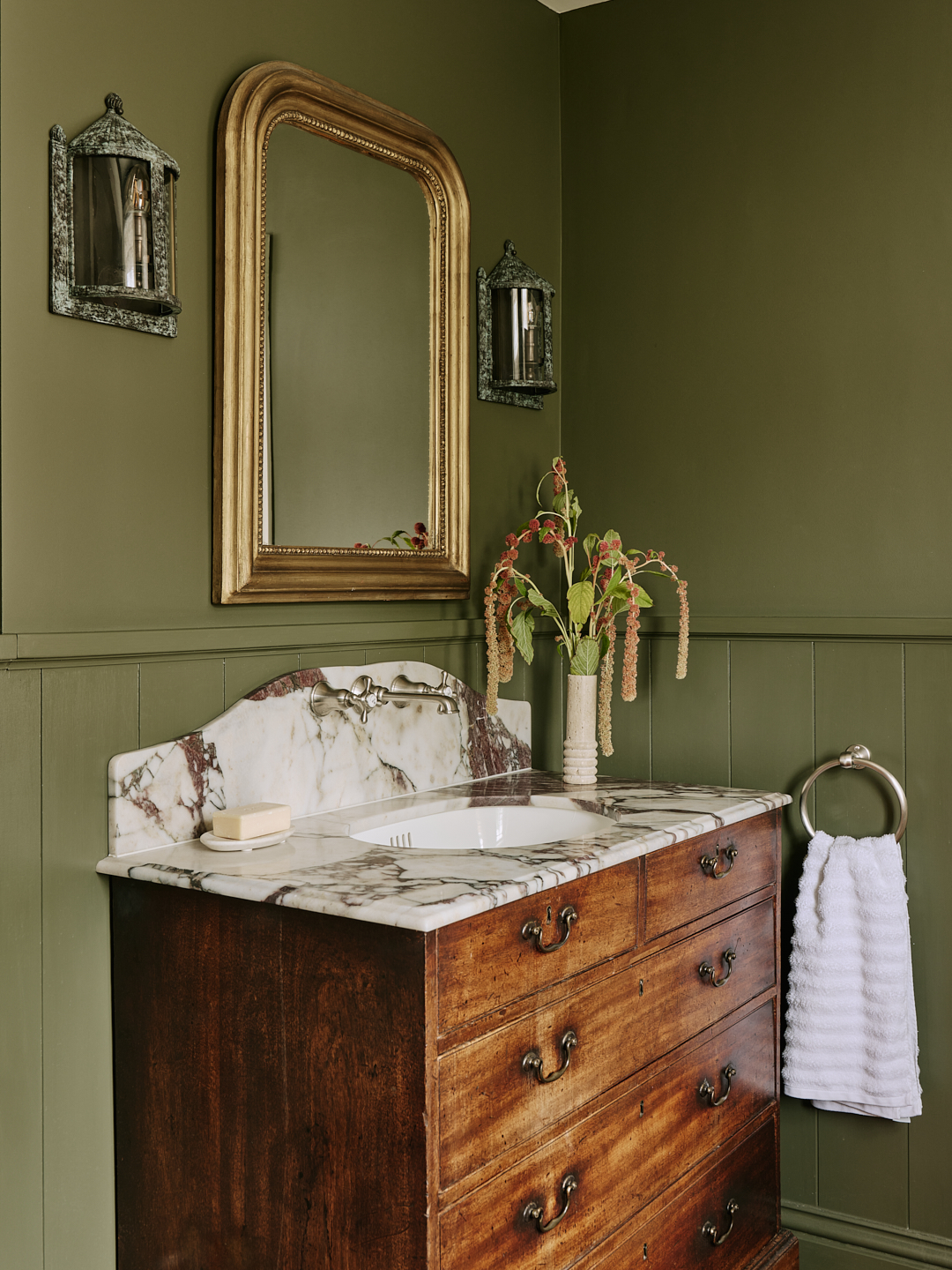 Cloakroom With Green Walls And Marble Topped Vanity Unit In Chelsea Townhouse