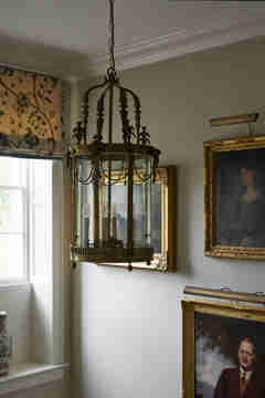 Gallery wall and lighting in Grade II listed estate designed by Sims Hilditch