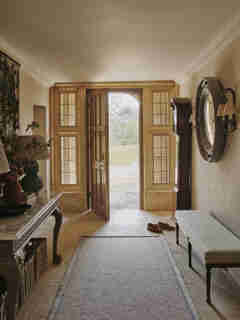 Formal entrance to Grade II listed cotswold manor house, interiors designed by Sims Hilditch