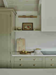 Muted green kitchen designed by Sims Hilditch