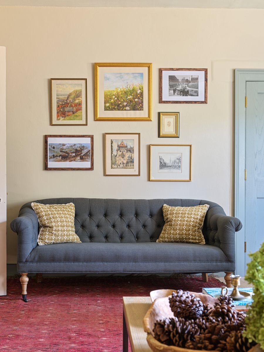 Sims Hilditch Interior Design Navy Sofa With Red Carpet And Picture Wall