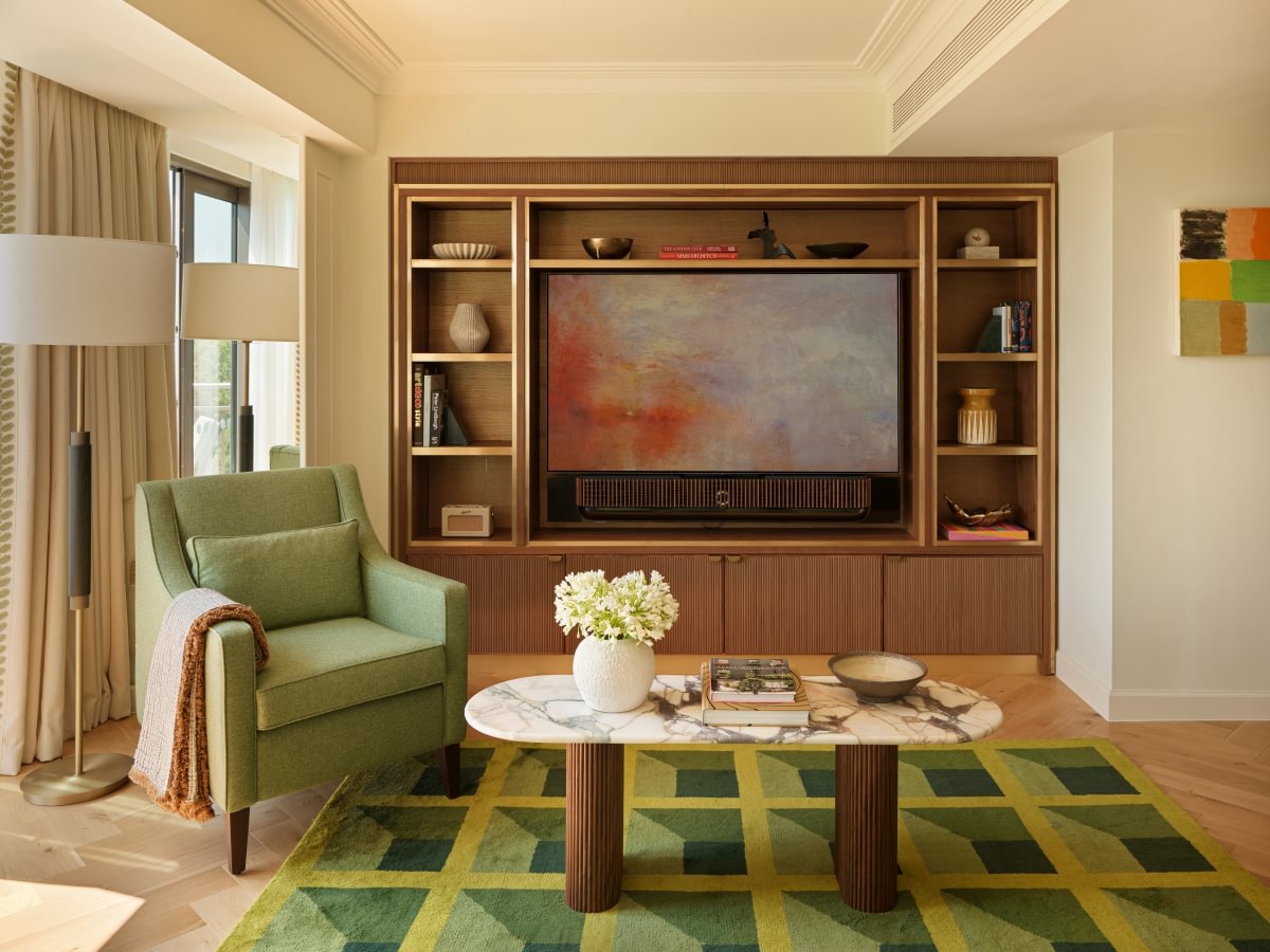 Sims Hilditch Interior Design Mayfair Hotel Apartment Living Area Coffee Table Green Armchair Rug