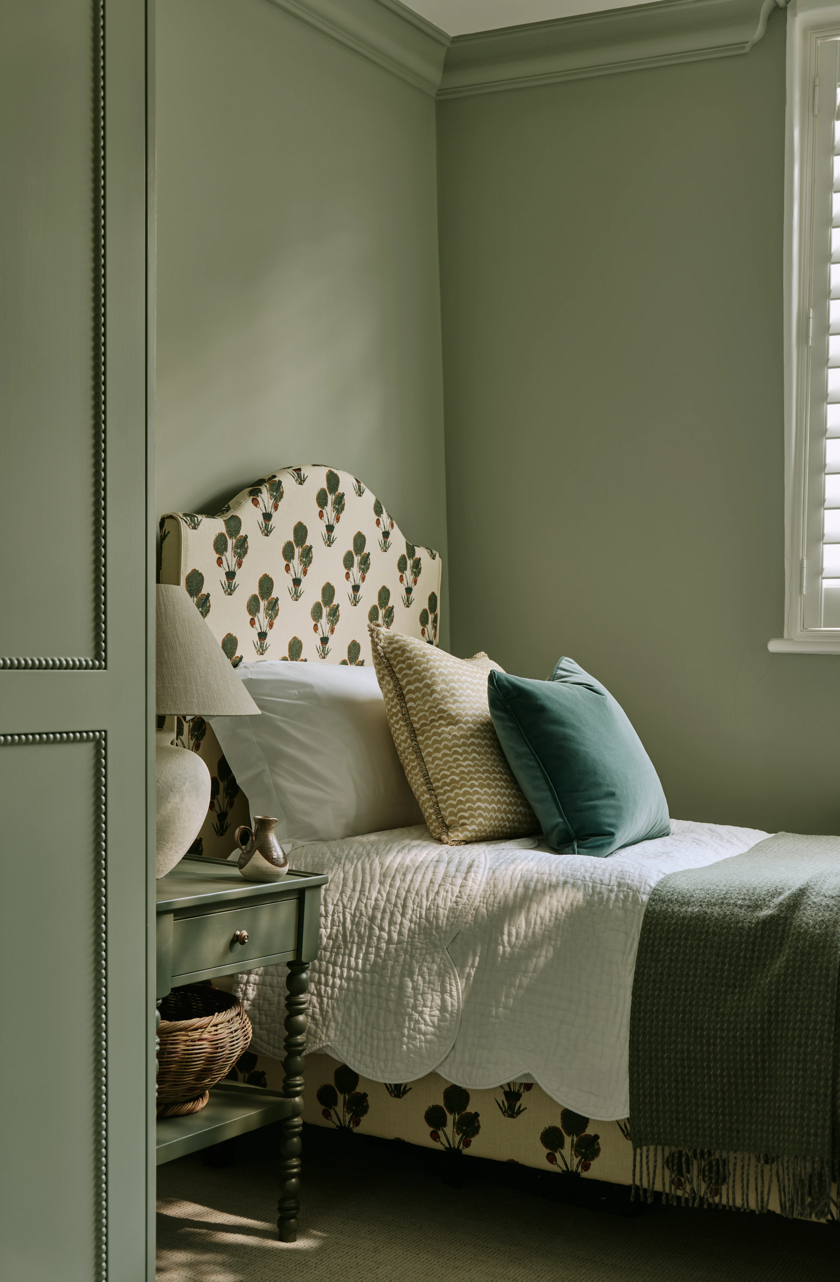 bedroom-with-green-walls-and-patterned-headboard-in-south-kensington-family-home-project