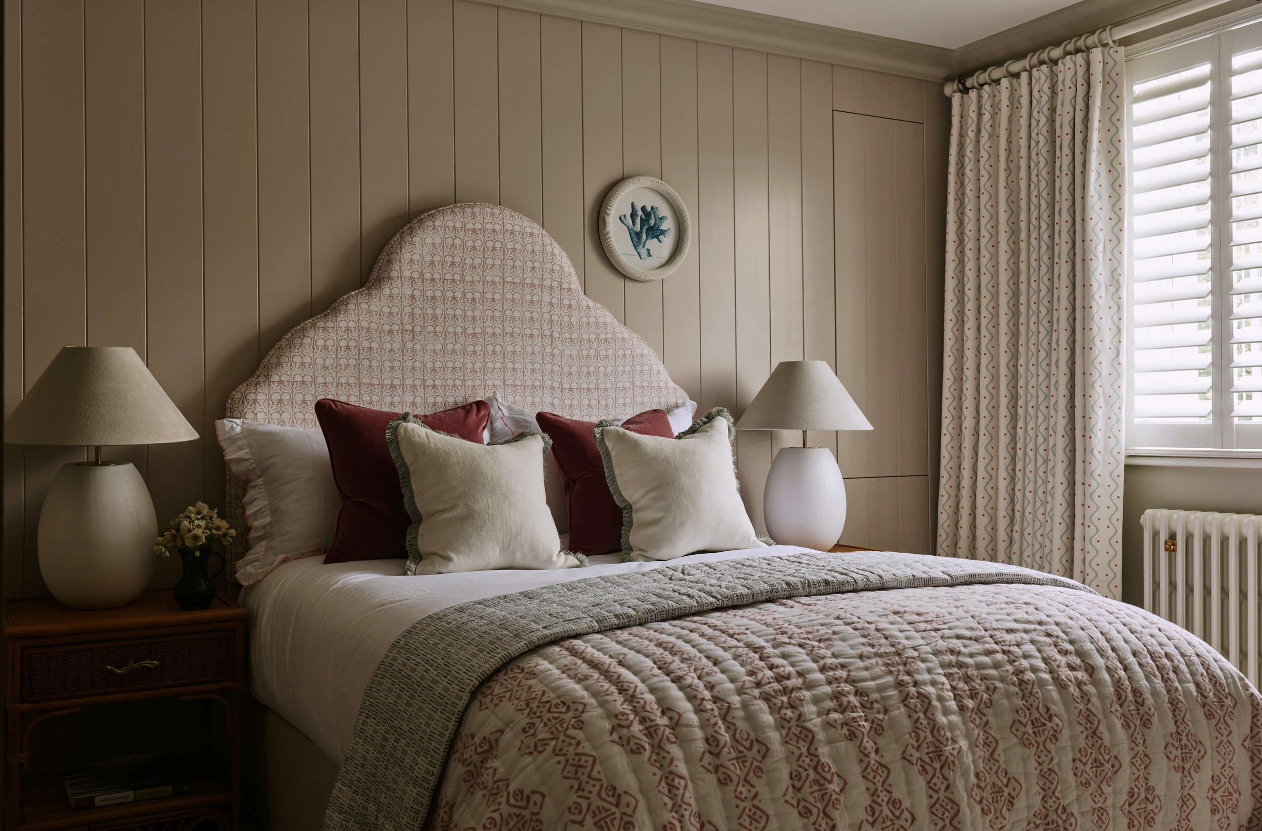 bedroom-with-panelled-walls-and-pink-fabrics-in-south-kensington-family-home-project