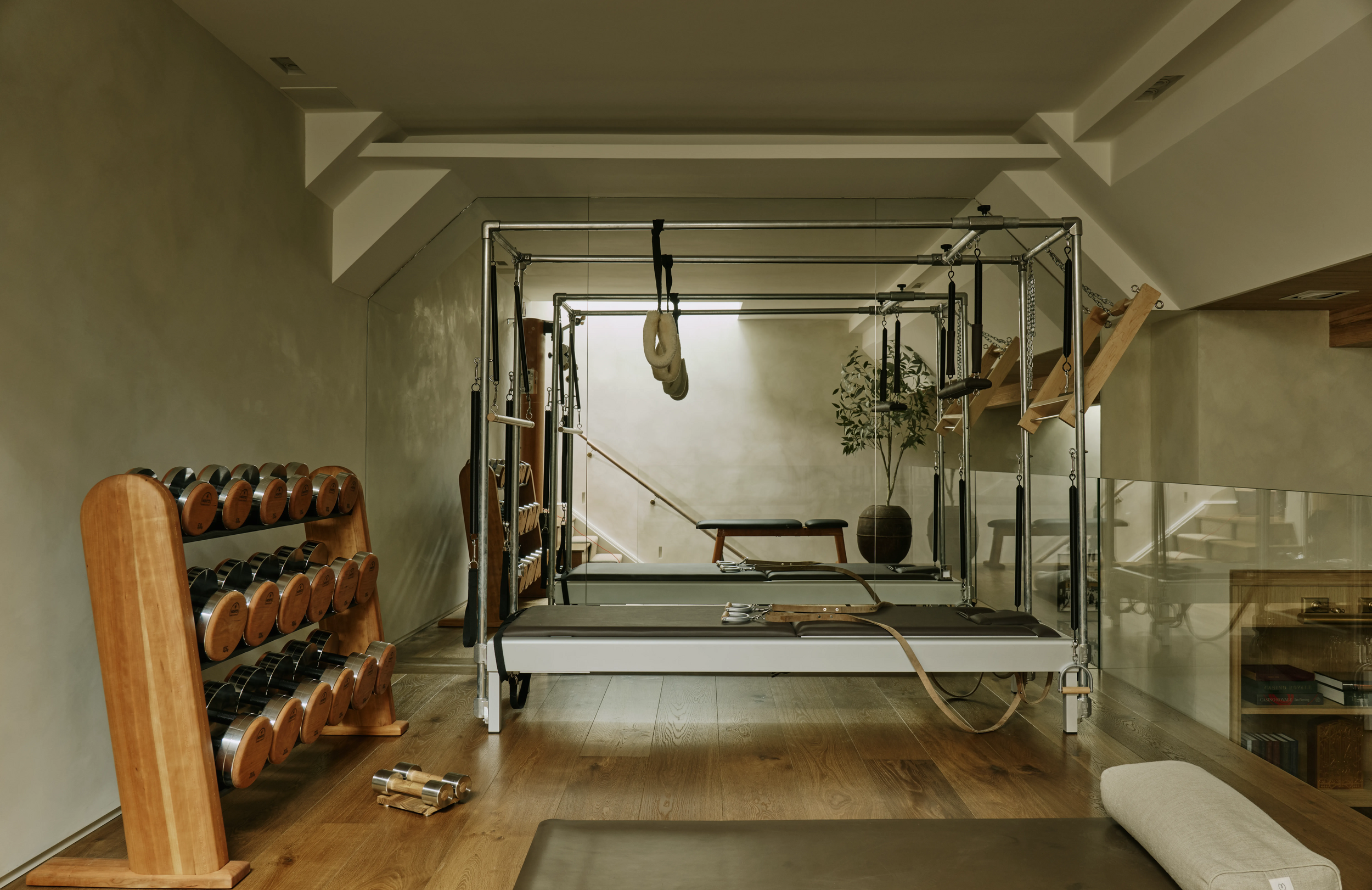 gym-area-with-pilates-beds-and-weights-in-south-kensington-family-home-project